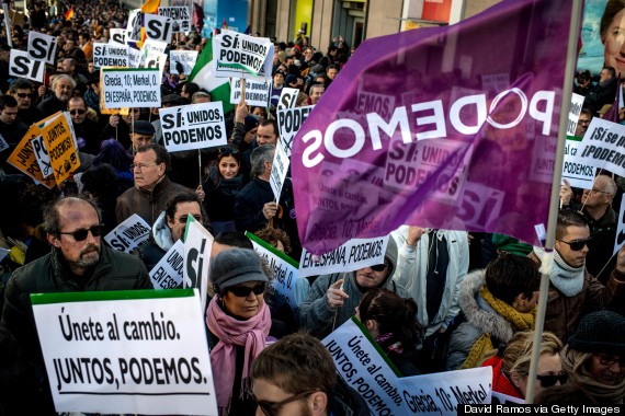 MADRID, SPAIN - JANUARY 31:  People hold up banners during a march of Podemos (We can) political party on January 31, 2015 in Madrid, Spain. According to the last opinion polls Podemos (We Can), the anti-austerity left-wing party emerged out of popular movements and officially formed last year, has wider support than the traditional parties of Spain, the Spanish Prime Minister's right-wing party Partido Popular and the main opposition party, the Socialist (PSOE). Spain will hold General Elections this year by the end of November.  (Photo by David Ramos/Getty Images)