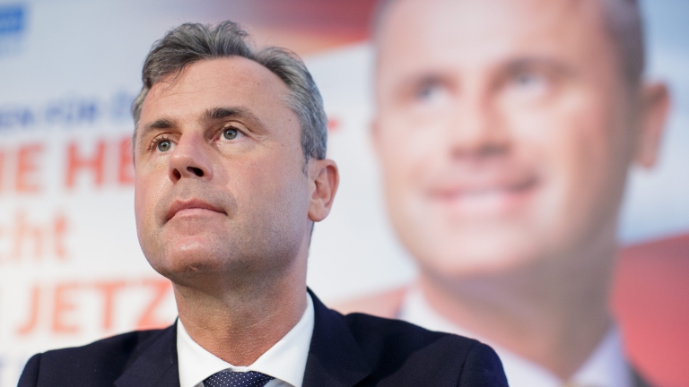 epa05210856 Right-wing Austrian Freedom Party (FPOE) presidential top candidate Norbert Hofer sits in front of an election advertisement billboard during a news conference in Vienna, Austria, 14  March, 2016. Austria's presidential elections take place on 24 April 2016.  EPA/LISI NIESNER