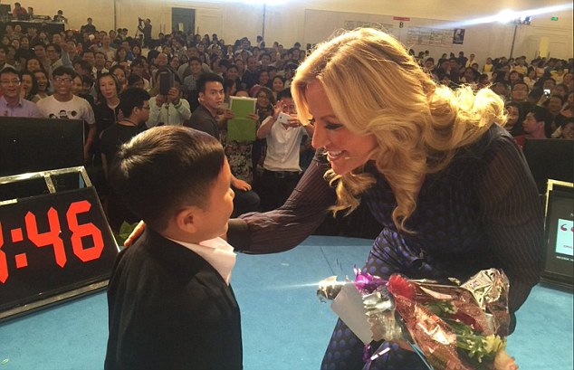 Lady Mone ø@MichelleMone  53m
Most embarrassing moment.Speaking in Vietnam to 3,000 people,thought this was a 6 year old,picked him up,he's a MAN
***TWITTER PICTURE FROM MICHELLE MONE PAGE***