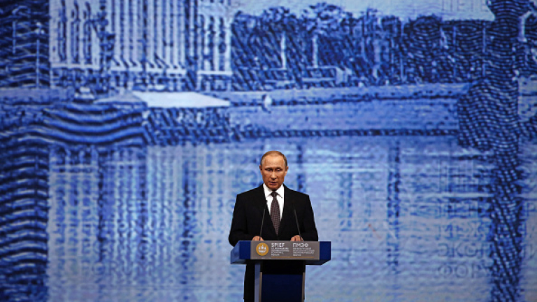 Vladimir Putin, Russia's president, speaks to business leaders on day two of the St. Petersburg International Economic Forum 2016 (SPIEF) in Saint Petersburg, Russia, on Friday, June 17, 2016. The 20th anniversary St. Petersburg International Economic Forum which brings together heads of state and governments, political leaders, leading experts and global company executives runs from June 16-18. Photographer: Simon Dawson/Bloomberg via Getty Images