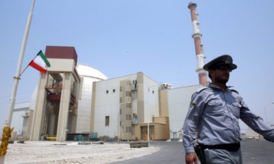 epa05070463 (FILE) A file photograph showing an Iranian security officer walking in front of the nuclear power plant in Bushehr , southern Iran on 21 August 2010. Media reports on 15 December 2015 state that the 35 countries on the governing board of the International Atomic Energy Agency (IAEA) unanimously took note of the agency's recent final report on its inquiry, which found that Iran had conducted various nuclear weapons research projects that have now ended.  EPA/ABEDIN TAHERKENAREH *** Local Caption *** 51186417