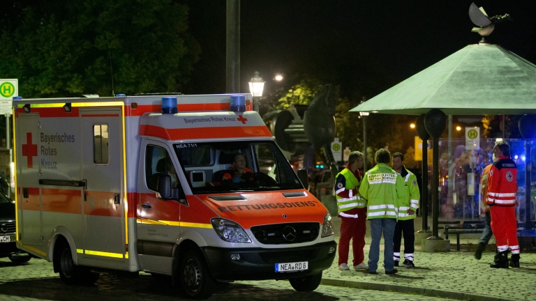 epa05439736 An ambulance is seen at the scene of an explosion in Ansbach, Germany, 25 July 2016. A man was killed and 12 others were injured in an explosion in Franconia Ansbach late on 24 July. According to police, the explosion occurred on a downtown street in front of a restaurant. The nature and cause of the explosion are still unclear.  EPA/DANIEL KARMANN
