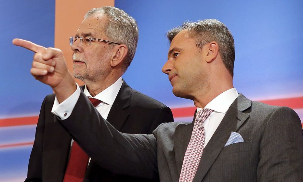 Presidential candidates Alexander van der Bellen (L) and Norbert Hofer react during a TV debate in Vienna, Austria, April 24, 2016. REUTERS/Heinz-Peter Bader