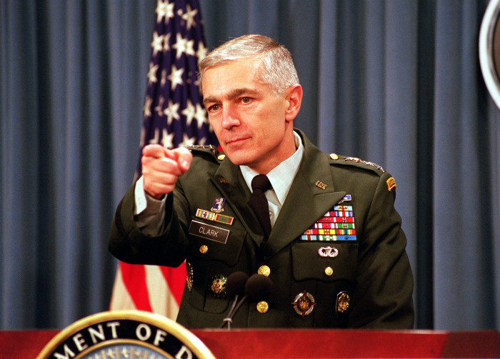 991209-D-9880W-048
	Supreme Allied Commander Europe Gen. Wesley Clark, U.S. Army, takes questions from reporters during a briefing at the Pentagon on the status of the NATO-led, international peacekeeping operation in Bosnia and Herzegovina on Dec. 9, 1999.  The first U.S. peacekeepers entered the war-ravaged country five years ago this month in an effort to stop the ethnic killings and prevent further deterioration of the region's infrastructure.  DoD photo by R. D. Ward.  (Released)