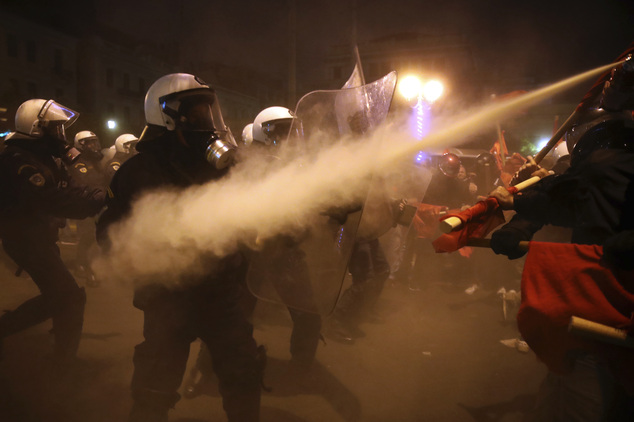 Police and demonstrators clash during a protest against the visit of US President Barack Obama in Athens, Tuesday, Nov. 15, 2016. Greek police say about 3,000 anarchists, leftwing group supporters and students are marching through central Athens, to protest President Barack Obama's visit. (AP Photo/Yorgos Karahalis)