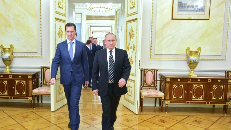 epaselect epa04986384 A picture made available on 21 October 2015 shows Russian President Vladimir Putin (R) and Syrian President Bashar al-Assad entering a hall during their meeting at the Kremlin in Moscow, Russia, 20 October 2015. Beleaguered Syrian President Bashar al-Assad travelled to Moscow for talks with his Russian counterpart Vladimir Putin, the Kremlin revealed on 21 October 2015. Assad and Putin discussed the situation in war-torn Syria on 20 October 2015 evening during the talks that had not been made public in advance, the Kremlin spokesman said. The talks dealt with the 'fight against terrorist extremist groups' and with Russian air support for attacks by Syrian troops on the ground. Russia has been carrying out airstrikes in Syria since the end of September. Moscow has declared the so-called Islamic State (IS or ISIS) as the main enemy, but Western nations have accused Moscow of attacking other groups opposed to the Assad regime.  EPA/ALEXEY DRUZHINYN/RIA NOVOSTI/POOL
