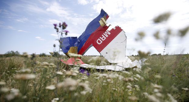 A part of the wreckage of Malaysia Airlines Flight MH17 is seen at its crash site, near the village of Hrabove, Donetsk region, July 20, 2014. U.S. Secretary of State John Kerry on Sunday laid out what he said was overwhelming evidence of Russian complicity in the downing of the Malaysian airliner in eastern Ukraine as he made the U.S. case against Moscow in the most emphatic and explicit terms yet. REUTERS/Maxim Zmeyev (UKRAINE - Tags: DISASTER POLITICS TRANSPORT CONFLICT TPX IMAGES OF THE DAY)