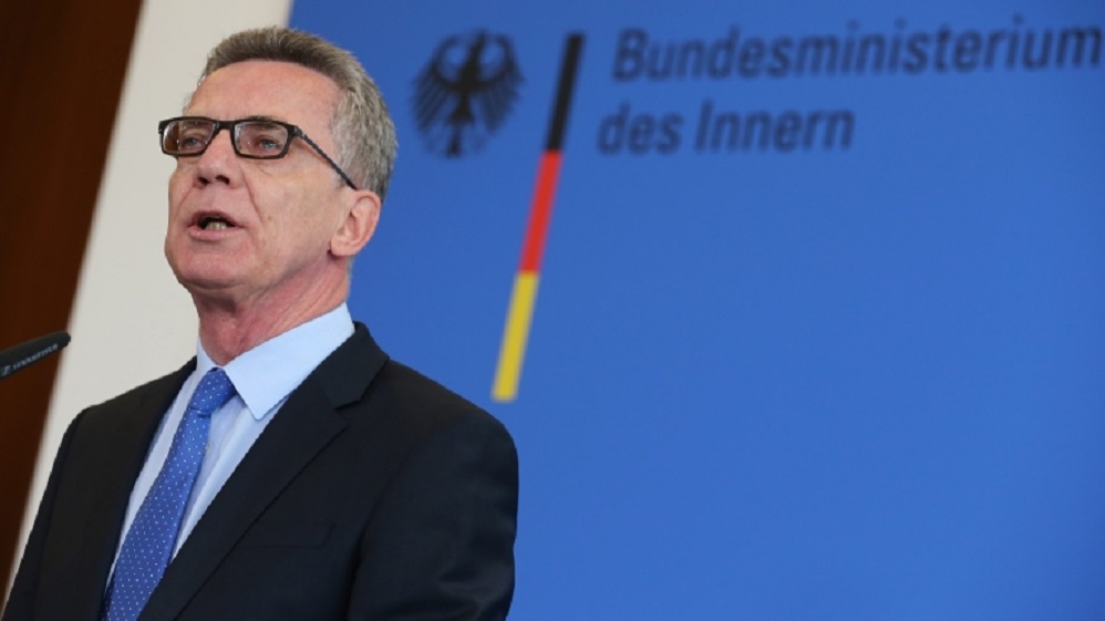 epa05473221 German Federal Interior Minister Thomas de Maiziere speaks at a news conference in Berlin, Germany, 11 August 2016, during which he presented measures to increase the security in Germany. De Maiziere reportedly proposed what was dubbed a 'Technology Offensive' with increased video surveillance and creating posts for 15,000 new police officers. Media reports said that he also refused calls of his German regional Interior minister colleagues for a ban of full body veils, or burkhas, and for skipping the dual citizenship.  EPA/WOLFGANG KUMM