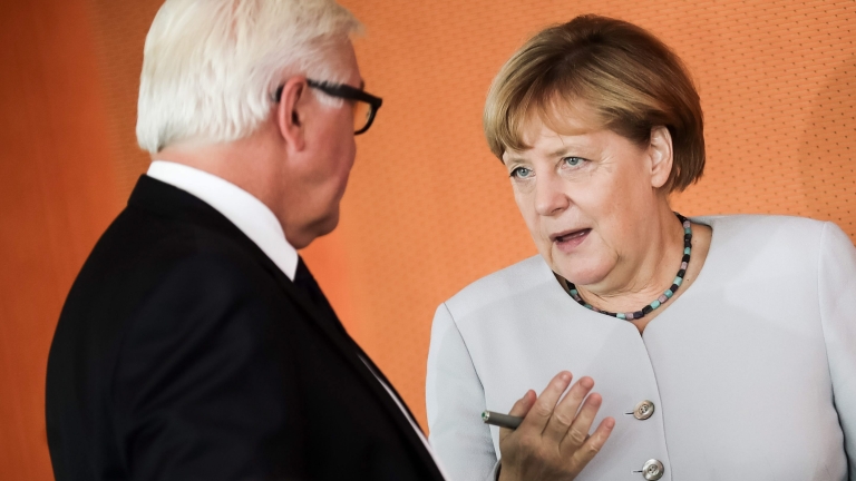 epa05538851 German Chancellor Angela Merkel (R) talks to German Minister of Foreign Affairs Frank-Walter Steinmeier (L) during a meeting of the federal cabinet at the chancellery in Berlin, Germany, 14 September 2016. An introduction of a flexible pension was one of the topics discussed during the meeting, according to media recports.  EPA/MICHAEL KAPPELER