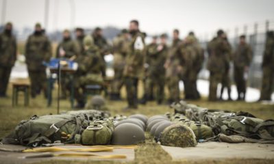 epa05768752 German soldiers stand behind automatic parachutes during their course at the Bundeswehr airborne operations training centre in Altenstadt, southern Germany, 03 February 2017.  EPA/PHILIPP GUELLAND