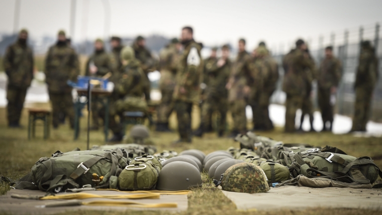 epa05768752 German soldiers stand behind automatic parachutes during their course at the Bundeswehr airborne operations training centre in Altenstadt, southern Germany, 03 February 2017.  EPA/PHILIPP GUELLAND