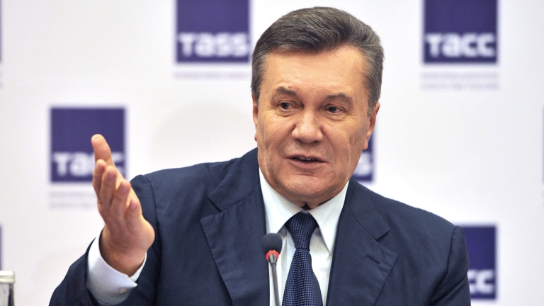 epa05647610 Ukrainian ex-president Viktor Yanukovych speaks during a news conference after a video link with a Ukrainian district court in Kiev at a trial session, Rostov-on-Don, Russia 25 November 2016. Svyatoshinsky District Court of Kyiv holds a hearing in the case of the Maidan events, with question as a witness to Ukrainian ex-president Viktor Yanukovych in the case of five former Berkut riot police officers, who are accused of murdering the Maidan activists in February 2014. Viktor Yanukovych testifies from the Rostov regional court in Russia via video conference.  EPA/ALEXANDER BLOTNITSKY