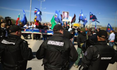 epa05867556 Bulgarian police officers keep watch as supporters of the Bulgarian National-Patriotic Party block the border between Bulgaria and Turkey, at the Kapitan Andreevo check point, some 350km south-east of Sofia, Bulgaria, 24 March 2017. About 150 ultra-nationalists blocked the main checkpoint between Turkey and Bulgaria, in Kapitan Andreevo, to prevent, as they say, buses transporting voters of double nationality, Bulgarian and Turkish, to participate in the parliamentary elections on 26 March. The organizers of the protest, members of the Patriots United nationalist electoral alliance in Bulgaria (VMRO, National Front for Salvation of Bulgaria and Ataka), repeated the blocking as they organized a similar demonstration a few days earlier and promised to maintain it till election day. From the beginning of March there has been increasing tensions between Bulgaria and Turkey due to various Turkish officials calls to vote for certain ethnic Turkish parties in Bulgaria, a move condemned by Sofia as interference in internal affairs.  EPA/VASSIL DONEV