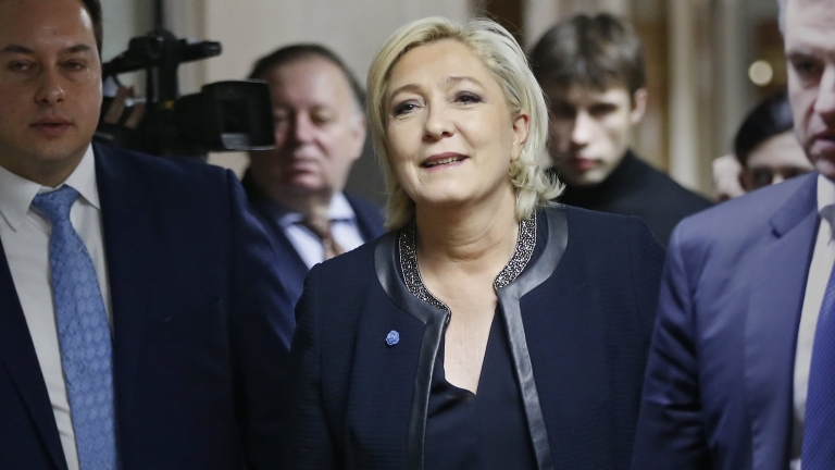 epa05867115 French presidential candidate Marine Le Pen (C) walks before her meeting with Russian State Duma international affairs committee headed by Leonid Slutsky (not pictured) at the State Duma building in Moscow, Russia, 24 March 2017.  EPA/YURI KOCHETKOV