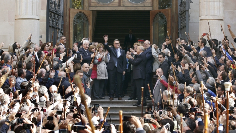 epa05845887 (FILE) A file photograph dated 15 October 2015 shows former Catalonian Regional President Artur Mas (C), with his supporters as he leaves the Superior Court of Catalonia where he made a statement before the judge on the accusation made by the District Attorney's office for calling the referendum on independence on 09 November 2014. Catalonian High Court (TSJC) on 13 March 2017 has sentenced Mas for a two-year long disqualification for holding a non-binding popular referendum on the region's secession from Spain despite it being banned by the Constitutional Court.  EPA/ANDREU DALMAU