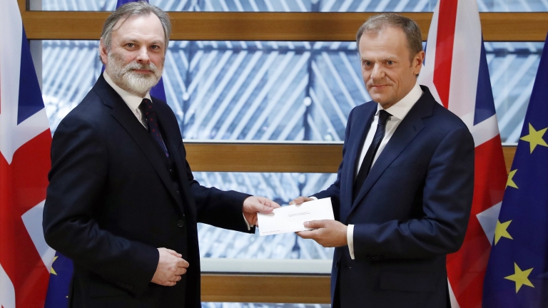 epa05876934 British ambassador to the EU, Sir Tim Barrow (L) delivers the official notice under Article 50 of the Lisbon Treaty to European Council President Donald Tusk in Brussels, Belgium, 29 March 2017, as part of the process that starts the formal proceedings of United Kingdom leaving the European Union. Britain's Prime Minister earlier in the day signed the notice, following the June 2016 referendum to vote on Britain staying or leaving the European Union.  EPA/YVES HERMAN / POOL