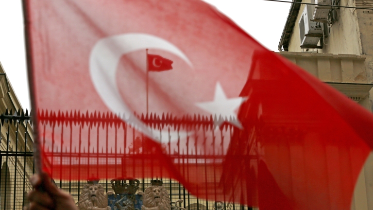 epa05843834 A Turkish flag flies on the roof of  the Dutch Consulate during a protest in Istanbul, Turkey 12 March 2017. Turkish Family Minister Fatma Betul Sayan Kaya was barred by police from entering the Turkish consulate in Rotterdam on 11 March, after the Dutch government had denied landing rights to Turkish Foreign Minister Cavusoglu who planned a speech at the consul's residence in Rotterdam. The incidents have led to a diplomatic row between the two countries, and protests by Turkish citizens in the Netherlands as well as in Turkey.  EPA/CEM TURKEL