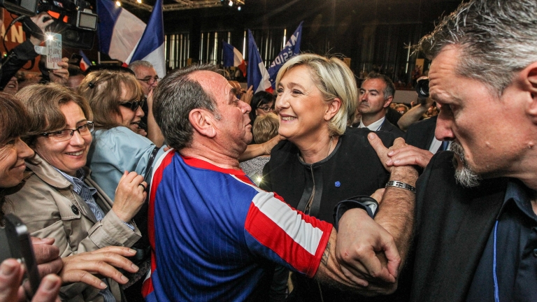 epa05914893 (FILE) A file picture dated 15 April 2017 shows Marine Le Pen (C), French National Front (FN) political party leader and candidate for French 2017 presidential election, cheered by supporters during an election campaign rally in Perpignan, France. France holds the first round of the 2017 presidential elections on 23 April 2017.  EPA/FREDERIC SCHEIBER