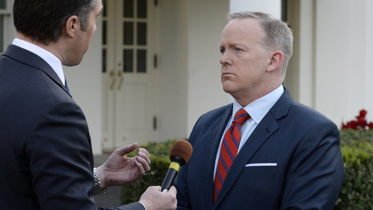 epa05903567 White House Press Secretary Sean Spicer (R) apologizes during a TV interview for his Hitler comparison while discussing Syria's use of chemical weapon at his daily briefing, at the White House in Washington, DC, USA, 11 April 2017.  EPA/Olivier Douliery / POOL