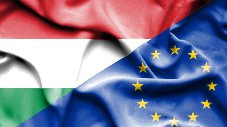 Waving flag of European Union and Hungary