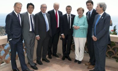 epa05992914 A handout photo made available by the Chigi Palace Press office on 27 May 2017 shows the G7 and Europe leaders with (L-R) European Council President Donald Tusk, Japanese Prime Minister Shinzo Abe, European Commission President Jean-Claude Juncker, US President Donald J. Trump, French President Emmanuel Macron, German Chancellor Angela Merkel, Canada's Prime Minister Justin Trudeau and hosting Italian Prime Minister Paolo Gentiloni standing together for a group photo during the G7 Summit extended session in the Sicilian town of Taormina, Italy, on its second day on 27 May 2017. The second day is scheduled to deal with Innovation and Development in Africa, Global Issues such as Human Mobility, Food Security and Gender Equality as well as the G7 Global Relations,  the Italian G7 Presidency said in a media release.  EPA/TIBERIO BARCHIELLI/CHIGI PRESS OFFICE HANDOUT  HANDOUT EDITORIAL USE ONLY/NO SALES