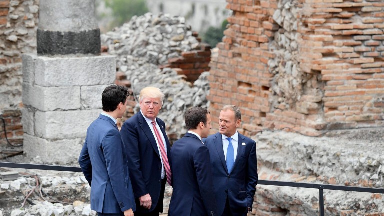 epa05991216 (L-R) Canadian Prime Minister Justin Trudeau, US President Donald J. Trump, French President Emmanuel Macron and EU Council President Donald Tusk leave after having posed for the group photo on the first day of the G7 Summit at the Teatro Greco in Taormina, Italy, 26 May 2017. Heads of States and of Governments of the G7, the group of most industrialized economies, plus the European Union, meet in Taormina, Italy, from 26 to 27 May 2017 for a summit titlked 'Building the Foundations of Renewed Trust' which is aimed at discussing 'citizen safety, economic, environmental and social sustainability and the reduction of inequalities' as well as 'innovation, skills and labor in the age of the Next Production Revolution', the Italian G7 Presidency said in a media release.  EPA/ETTORE FERRARI