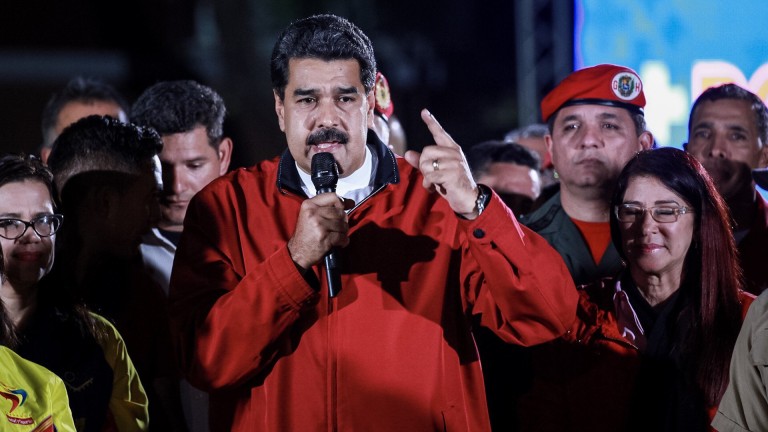 epa06118363 Venezuelan President Nicolas Maduro (C) celebrates election results after a national vote on his proposed Constituent Assembly at Plaza Bolivar in Caracas, Venezuela, 31 July 2017. The nation-wide vote on the Maduro-backed Constituent Assembly was marred by protests and violence that left at least nine people dead. If initiated, the new assembly would have the ability to bypass congress and rewrite the constitution.  EPA/NATHALIE SAYAGO