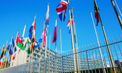 world flags in front of UNESCO headquarters in Paris, France