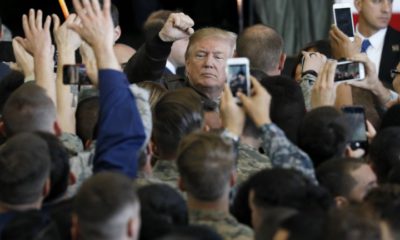 epa06309216 US President Donald J. Trump (C) gives high fives to US servicepersons at Yokota Air Base in Fussa, Tokyo Prefecture, Japan, 05 November 2017. Trump arrived in the outskirts of Tokyo on the first leg of his 12-day Asian tour, during which he will attend the Asia-Pacific Economic Cooperation (APEC) meeting in Vietnam.  EPA/KIMIMASA MAYAMA