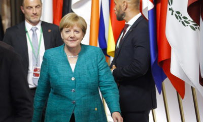epa06849056 Germany's Chancellor Angela Merkel walks at the end of a night of negotiation on migration during an European Council summit in Brussels, Belgium, 29 June 2018. EU countries' leaders met on 28 and 29 June for a summit to discuss migration in general, the installation of asylum-seeker processing centers in northern Africa, and other security- and economy-related topics including Brexit.  EPA/OLIVIER HOSLET