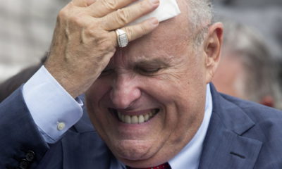 epaselect epa06774507 Attorney to US President Donald J. Trump Rudy Giuliani wipes his brow before the start of the White House Sports and Fitness Day at the South Lawn of the White House in Washington, DC, USA, 30 May 2018.  EPA/MICHAEL REYNOLDS