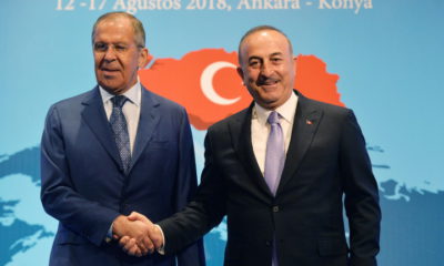 epa06948629 Turkish Foreign Minister Mevlut Cavusoglu (R) shakes hands with Russian Foreign Minister Sergei Lavrov (L) during their meeting at the 10th Ambassador Conference in Ankara, Turkey, 14 August 2018.  EPA/STR