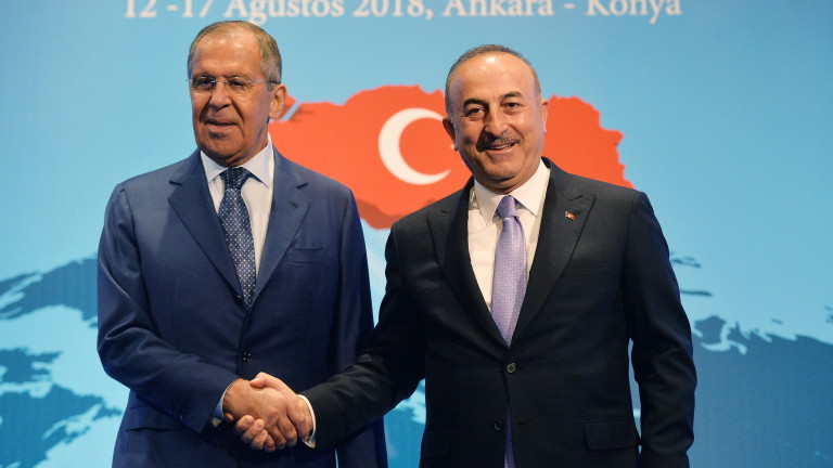 epa06948629 Turkish Foreign Minister Mevlut Cavusoglu (R) shakes hands with Russian Foreign Minister Sergei Lavrov (L) during their meeting at the 10th Ambassador Conference in Ankara, Turkey, 14 August 2018.  EPA/STR