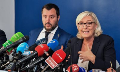 Far-right leader Marine Le Pen, right, and Italian Interior Minister and Deputy Premier, Matteo Salvini, smile before the start of the meeting "economic growth and social prospects in a Europe of nations, in Rome, Monday, Oct. 8, 2018. (Alessandro Di Meo/ANSA via AP)