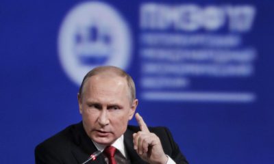 FILE - In this Friday, June 2, 2017, file photo, Russian President Vladimir Putin gestures as he speaks at the St. Petersburg International Economic Forum in St. Petersburg, Russia. Putin is dismissing as "a load of nonsense" the idea that Russia has damaging information on President Donald Trump and denies having any relationship with him, said Putin in an interview with NBC's "Sunday Night with Megyn Kelly." (AP Photo/Dmitry Lovetsky, File)