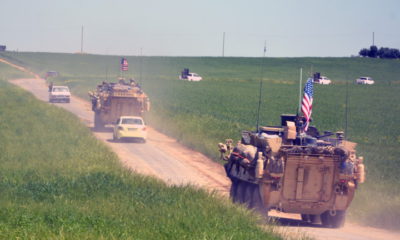 epa07240227 (FILE) - A convoy of US army troops and the People's Protection Units (YPG) Kurdish militia patrol near al-Ghanamya village, al-Darbasiyah town at the Syrian-Turkish border, Syria, 29 April 2017 (reissued 19 December 2018). US media reports on 19 December 2018 state USA may be in process of withdrawing all of its troops from Syria. An estimated 2,000 US troops, mainly located in Syria's north-east region, are in Syria with their primary task being the training of local units in their fight against the IS, the Islamic State militants.  EPA/YOUSSEF RABIE YOUSSEF