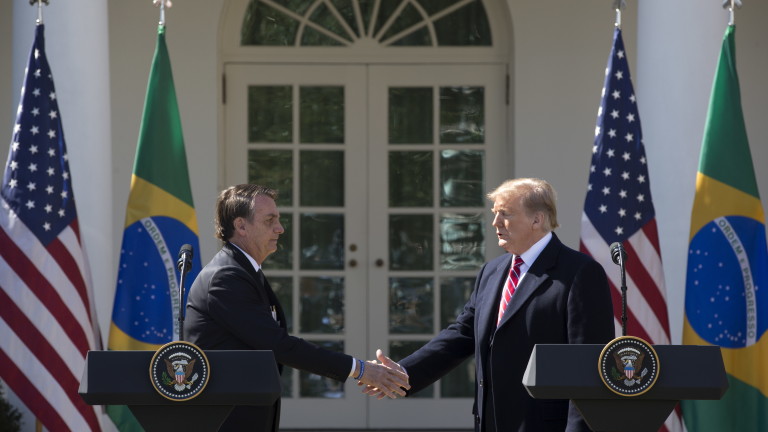 epa07448989 US President Donald J. Trump (R) and Brazilian President Jair Bolsonaro (L) shake hands at the conclusion of their joint news conference in the Rose Garden of the White House in Washington, DC, USA, 19 March 2019. Bolsonaro, a right-wing nationalist who earned the nickname the 'Trump of the Tropics,' met with President Trump for bilateral negotiations and a joint press conference.  EPA/MICHAEL REYNOLDS