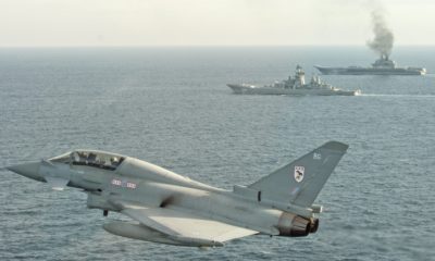 epa05749035 A handout photo made available 25 January 2017 by the British Ministry of Defence showing a Royal Air Force Typhoon shadowing  Russian Warships Petr Velikiy (centre) and the Admiral Kuznetsov (background) in the North Sea 24 January. . Typhoon aircraft were launched to monitor the Russian warships as they transit close to UK sovereign waters in order to ensure that their activity is monitored and executed safely in accordance with international procedures.  EPA/MOD Crown Copyright 2017 HANDOUT  HANDOUT EDITORIAL USE ONLY/NO SALES