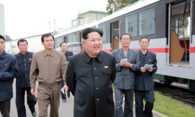 epa04990345 An undated picture released by the Rodong Sinmun, the newspaper of the ruling Workers Party, on 23 October 2015 shows North Korean leader Kim Jong-un (C) views a newly manufactured metro car during a visit to a train-making plant, in Pyongyang, North Korea.  EPA/Rodong Sinmun SOUTH KOREA OUT -- BEST AVAILABLE QUALITY