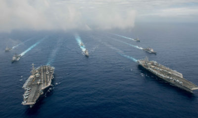 PHILIPPINE SEA - JUNE 18:  In this handout provided by the U.S. Navy, The Nimitz-class aircraft carriers USS John C. Stennis (CVN 74) (L) and USS Ronald Reagan (CVN 76) conduct dual aircraft carrier strike group operations in the U.S. 7th Fleet area of operations in support of security and stability in the Indo-Asia-Pacific.  (Photo by Specialist 3rd Class Jake Greenberg/U.S. Navy via Getty Images)