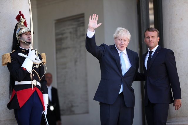 epa07785598 French President Emmanuel Macron (R) and British Prime Minister Boris Johnson (L) prior to their  meeting at the Elysee Palace in Paris, France, 22 August 2019. Johnson is in Paris after a one day visit in Berlin.  EPA/CHRISTOPHE PETIT TESSON