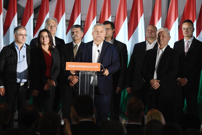 Hungarian Prime Minister Viktor Orban, center, speaks during the Fidesz-KDNP's event after the nationwide local elections in Budapest, Hungary, Sunday, October 13, 2019. From second right Outgoing Mayor of Budapest and candidate of the governing Fidesz-KDNP party Istvan Tarlos is seen. (Szilard Koszticsak/MTI via AP)