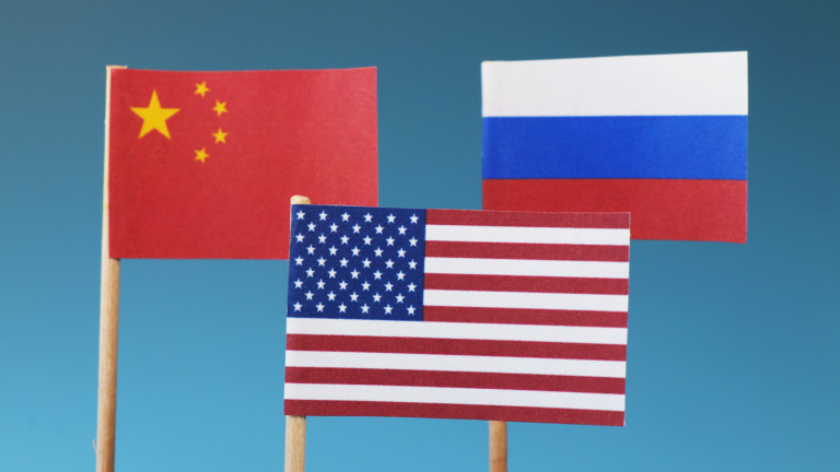 The main states on business war. The states who have main world in whole world. China, Russia, America and their flags. Blue background