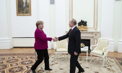 epa08119039 Russian President Vladimir Putin (R) shakes hands with German Chancellor Angela Merkel prior to talks in the Kremlin in Moscow, Russia, 11 January 2020. Merkel visits Moscow to discuss current international issues such as the situation in Syria, Libya, Ukraine, US-Iran tensions, as well as bilateral relations.  EPA/PAVEL GOLOVKIN / POOL