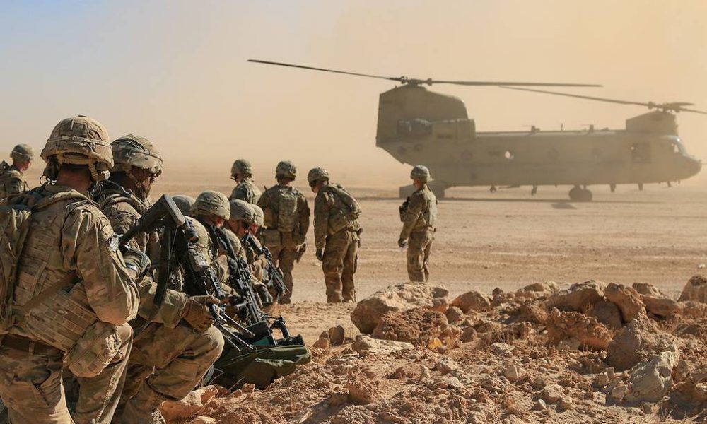 U.S. Soldiers assigned to Bandit Troop, 1st Squadron, 3rd Cavalry Regiment and deployed in support of Combined Joint Task Force – Operation Inherent Resolve await aerial extraction via CH-47 Chinook during an aerial response force live-fire training exercise in Iraq, Oct. 31, 2018. A number of training initiatives, collectively known as the Iraqi Air Enterprise, is underway across the Iraqi Air Force, Army Aviation, and Air Defense Commands. Continued growth towards Iraqi Security Forces (ISF) self-sufficiency will permit the Coalition to adjust the role and number of Coalition forces in Iraq in response to changing support requirements of the ISF. (U.S. Army National Guard photo by 1st Lt. Leland White)