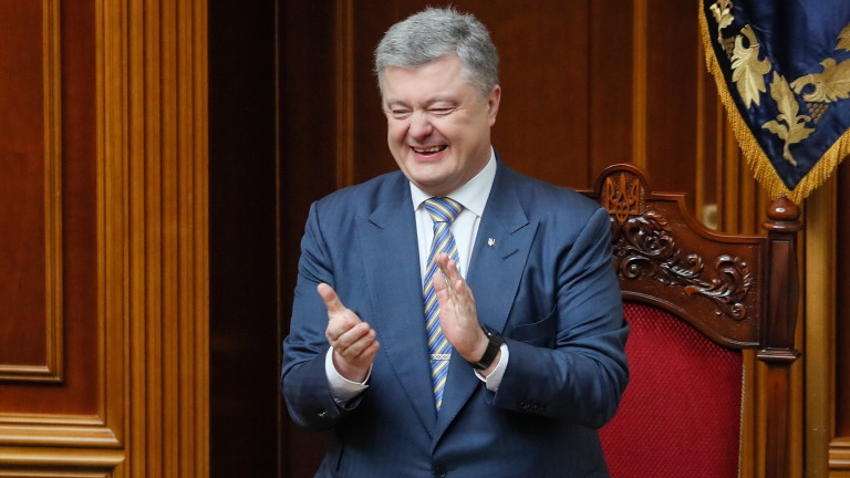 epa07349613 Ukrainian President Petro Poroshenko reacts during the Parliament's voting in Kiev, Ukraine, 07 February 2019. Ukrainian Parliament voted bills on amending the Constitution on the strategic course of the state to acquire full membership of Ukraine in the EU and NATO and it was accepted by lawmakers with 334 votes.  EPA/SERGEY DOLZHENKO