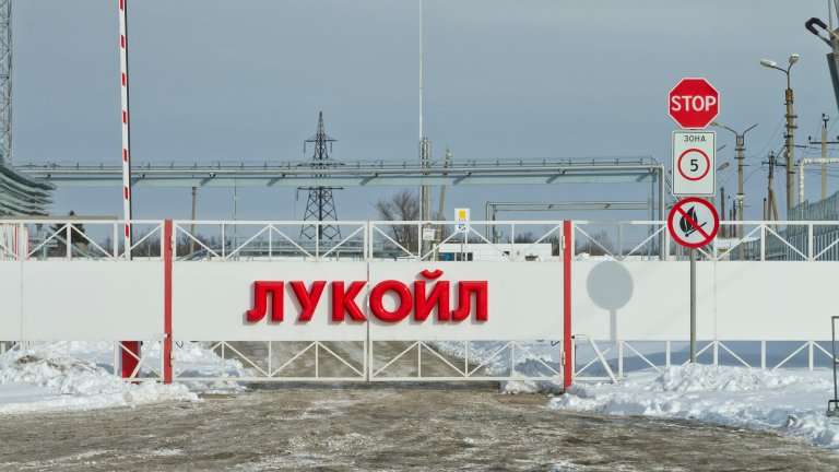 Volgograd, Russia - February 7, 2014: Automatic gates at the checkpoint with the inscription LUKOIL. Entry to the territory of the Volgograd oil depots through a checkpoint